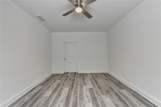 8305 Beryl Overlook, Gainesville, GA 30506 - spare room with wood finished floors, ceiling fan, and baseboards