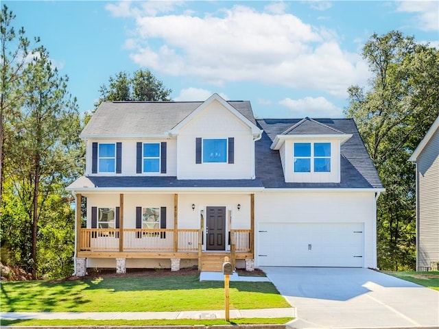 view of front of home featuring a garage, covered porch, a front lawn, and concrete driveway