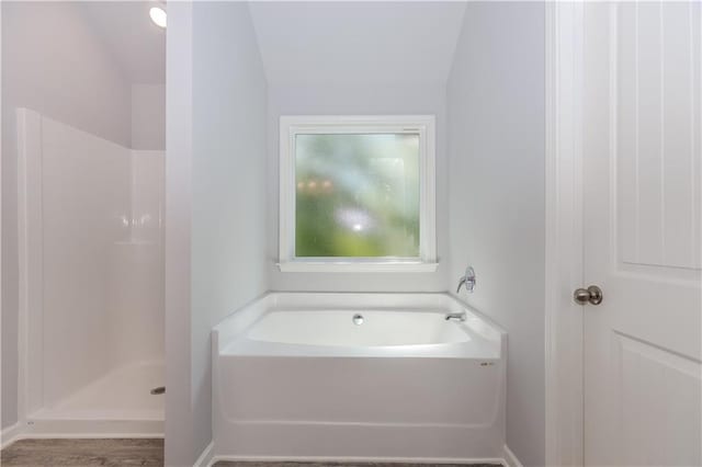 full bathroom with a garden tub and a walk in shower