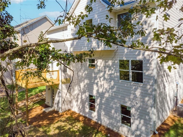 view of side of property featuring a deck