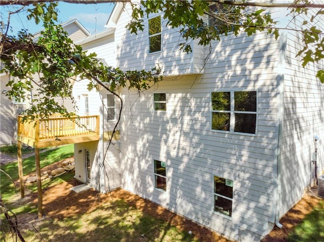 view of side of property with a wooden deck