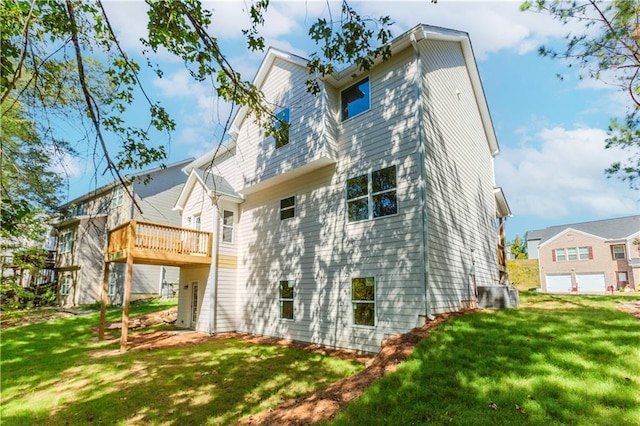 rear view of property featuring a lawn