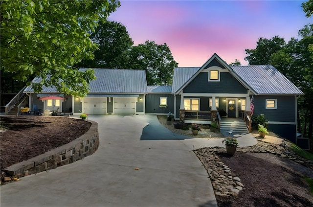 1832 Monument Rd, Jasper, GA 30143 - view of front of property featuring concrete driveway, covered porch, a garage, a metal roof, and stairway