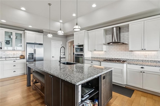 1832 Monument Rd, Jasper, GA 30143 - kitchen featuring wall chimney exhaust hood, open shelves, stainless steel appliances, backsplash, and light wood-style floors