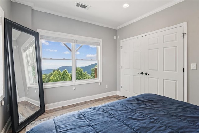 1832 Monument Rd, Jasper, GA 30143 - bedroom featuring wood finished floors, ornamental molding, a closet, and recessed lighting