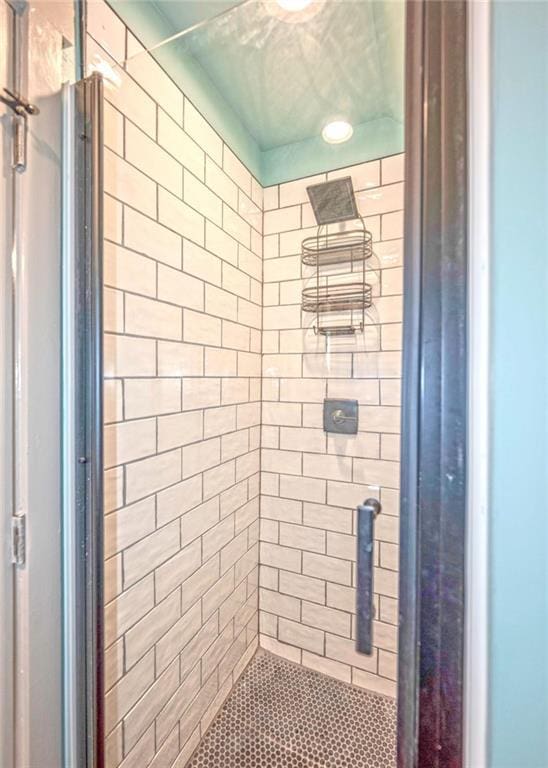 full bath with a shower stall