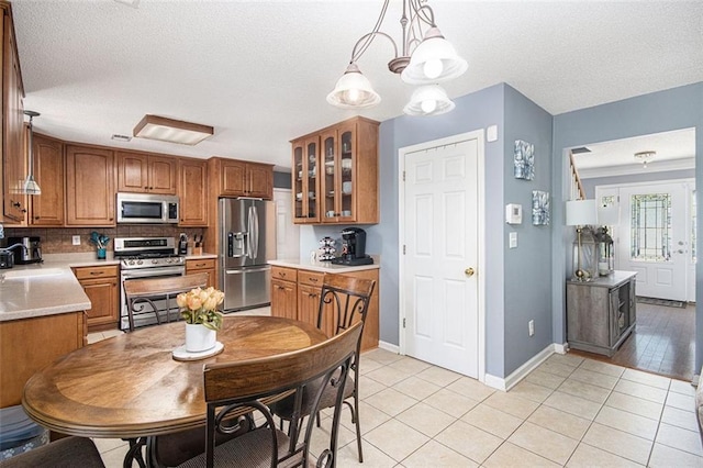 10 Callaway Ct, Hiram, GA 30141 - dining room featuring baseboards, a textured ceiling, and light tile patterned floors