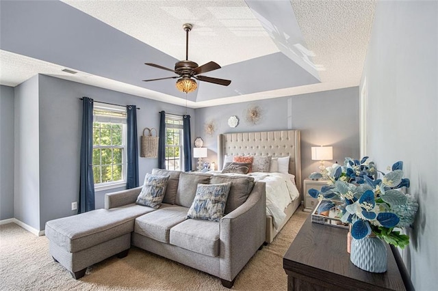 10 Callaway Ct, Hiram, GA 30141 - bedroom with a ceiling fan, a textured ceiling, light colored carpet, baseboards, and a tray ceiling
