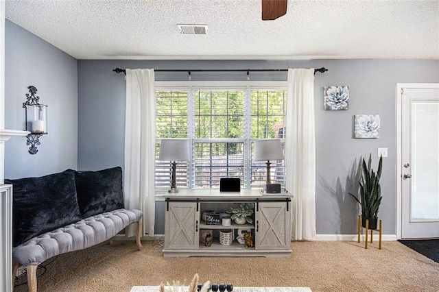 10 Callaway Ct, Hiram, GA 30141 - carpeted living room featuring baseboards, a textured ceiling, visible vents, and ceiling fan