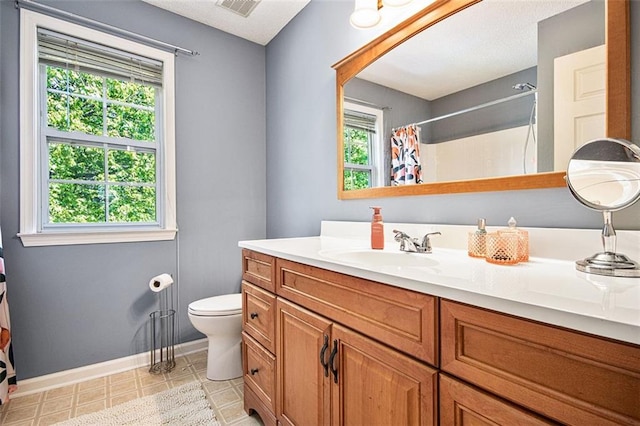 10 Callaway Ct, Hiram, GA 30141 - full bathroom featuring toilet, baseboards, a healthy amount of sunlight, and vanity