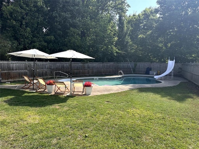 10 Callaway Ct, Hiram, GA 30141 - view of pool with a water slide, a fenced backyard, a fenced in pool, a patio, and a yard