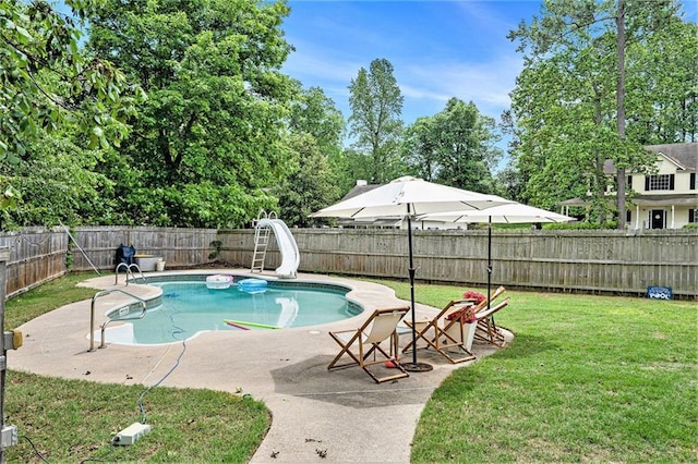10 Callaway Ct, Hiram, GA 30141 - view of swimming pool featuring a lawn, a water slide, a fenced backyard, and a patio area