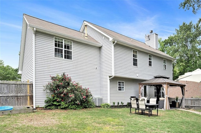 10 Callaway Ct, Hiram, GA 30141 - rear view of property featuring central AC, fence, a chimney, a gazebo, and a yard
