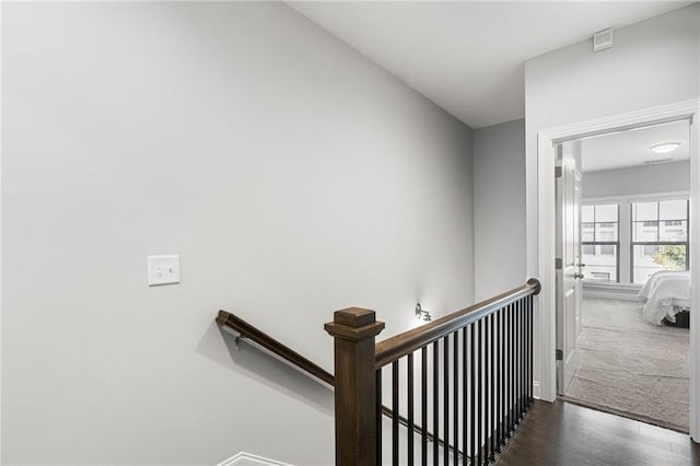 stairs with hardwood / wood-style floors