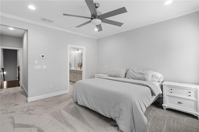 carpeted bedroom with ceiling fan, connected bathroom, and crown molding