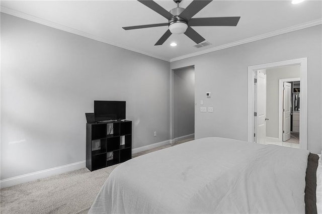 carpeted bedroom with ceiling fan and crown molding