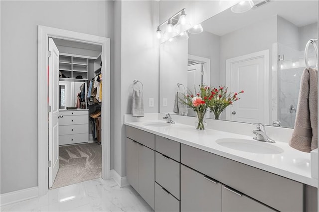 bathroom with walk in shower and vanity