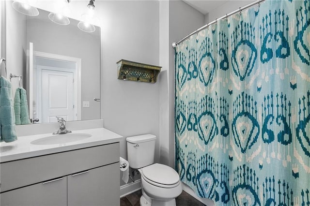 bathroom featuring vanity and toilet