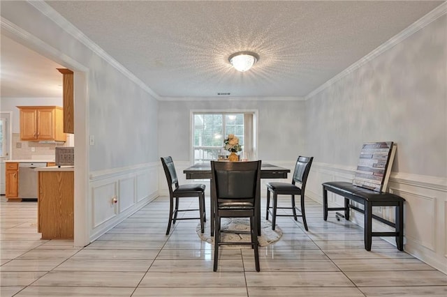 151 River Park Cir, Mcdonough, GA 30252 - dining room with healthy amount of natural light, a decorative wall, wainscoting, and crown molding