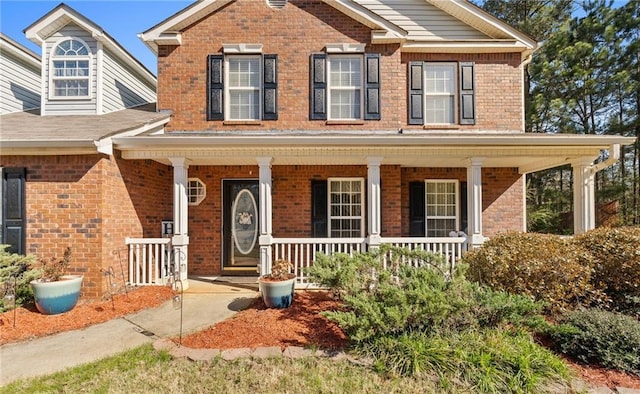 151 River Park Cir, Mcdonough, GA 30252 - view of front of home with brick siding and a porch