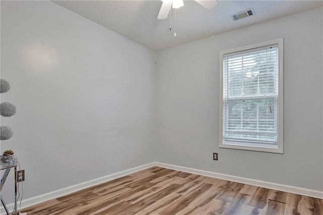 151 River Park Cir, Mcdonough, GA 30252 - unfurnished room featuring wood finished floors, baseboards, and a textured ceiling