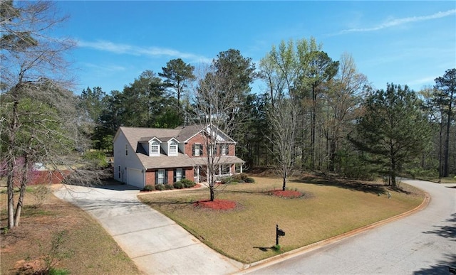 151 River Park Cir, Mcdonough, GA 30252 - traditional-style house with driveway, a garage, a front yard, and brick siding