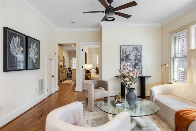 corridor featuring hardwood / wood-style floors and ornamental molding