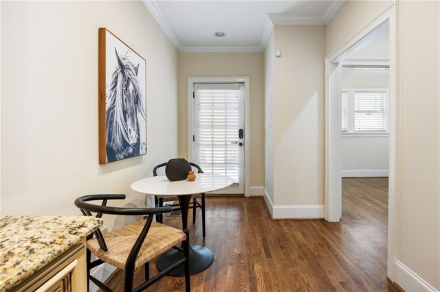 bedroom featuring crown molding, ceiling fan, a closet, and dark wood-type flooring