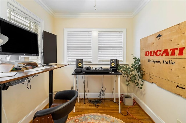 home office featuring hardwood / wood-style flooring, ornamental molding, and a wealth of natural light