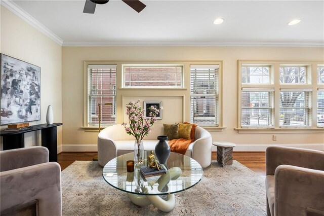 dining room with crown molding, a healthy amount of sunlight, and dark hardwood / wood-style floors