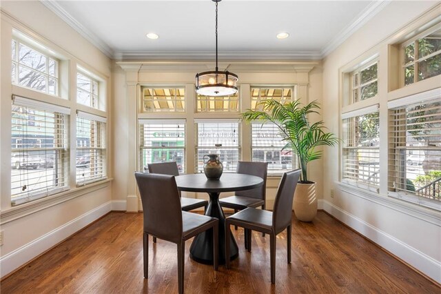 living room featuring dark hardwood / wood-style floors, ceiling fan, and ornamental molding