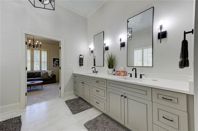 1892 Raven Hill Dr NE, Atlanta, GA 30319 - full bathroom with crown molding, a chandelier, baseboards, marble look tiles, and double vanity
