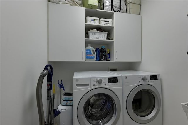 1892 Raven Hill Dr NE, Atlanta, GA 30319 - laundry room featuring washing machine and clothes dryer and cabinet space