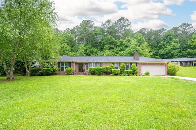 ranch-style house with a front lawn and a garage