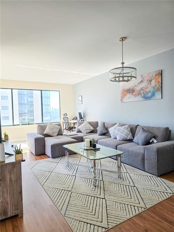 3481 Lakeside Dr NE Unit 2204, Atlanta, GA 30326 - living room featuring a chandelier and wood finished floors