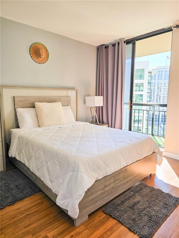 3481 Lakeside Dr NE Unit 2204, Atlanta, GA 30326 - bedroom featuring wood finished floors