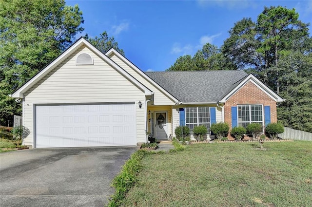 ranch-style house featuring a front yard and a garage