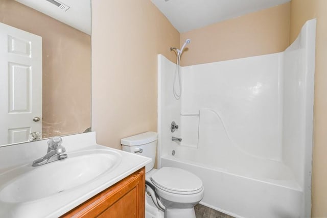 bathroom featuring shower / tub combination, visible vents, toilet, and vanity