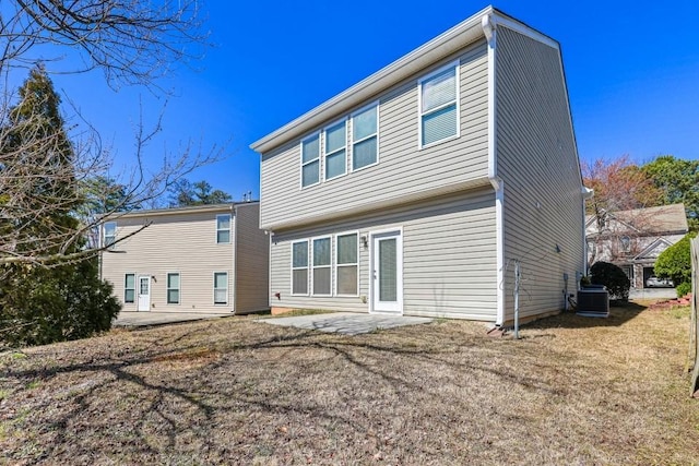 rear view of house with a patio and central AC unit