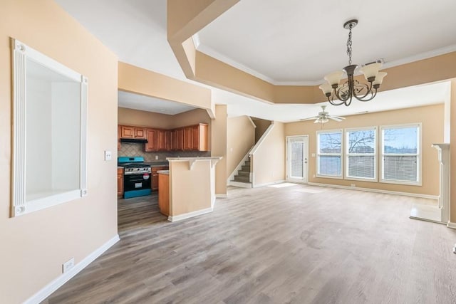 interior space with light wood finished floors, stairway, and ornamental molding