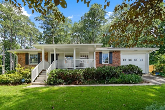 1959 Audubon Dr NE, Atlanta, GA 30329 - ranch-style house featuring a garage, a porch, brick siding, and a front yard