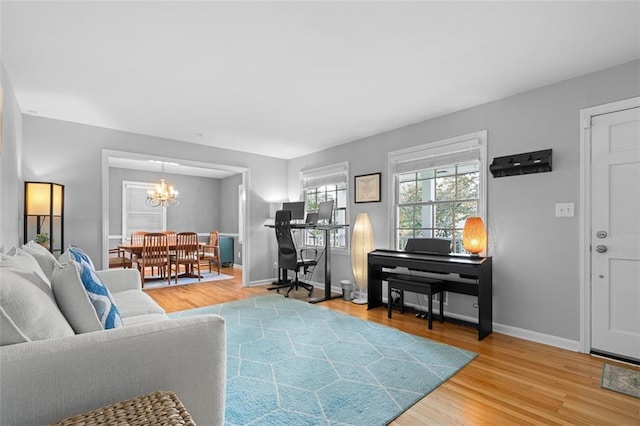 1959 Audubon Dr NE, Atlanta, GA 30329 - living area featuring a chandelier and light wood-style flooring