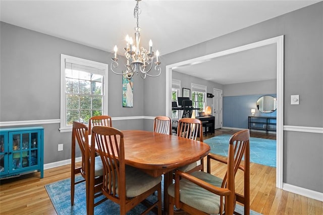 1959 Audubon Dr NE, Atlanta, GA 30329 - dining area featuring plenty of natural light, light wood finished floors, and a chandelier