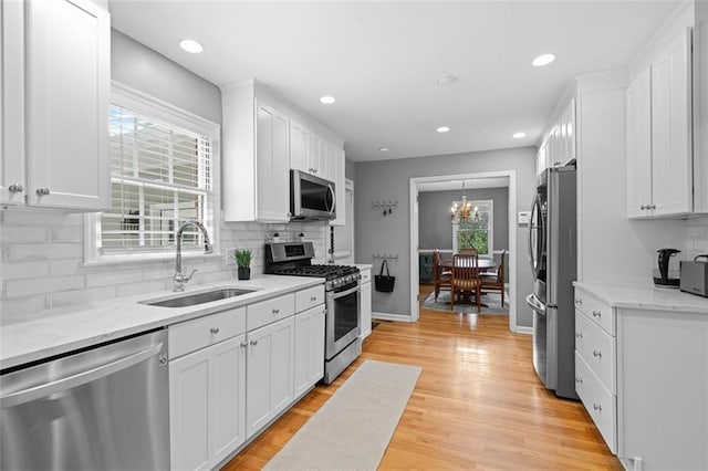 1959 Audubon Dr NE, Atlanta, GA 30329 - kitchen featuring stainless steel appliances, white cabinetry, healthy amount of natural light, and recessed lighting