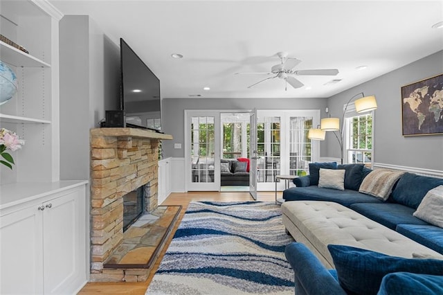 1959 Audubon Dr NE, Atlanta, GA 30329 - living area with light wood-type flooring, a ceiling fan, recessed lighting, a fireplace, and french doors