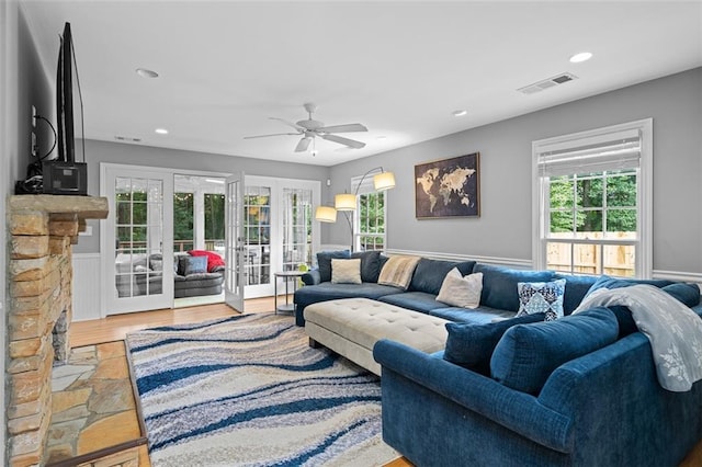 1959 Audubon Dr NE, Atlanta, GA 30329 - living room featuring french doors, ceiling fan, healthy amount of natural light, wainscoting, and recessed lighting