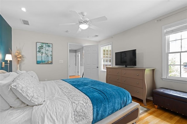 1959 Audubon Dr NE, Atlanta, GA 30329 - bedroom featuring light wood-type flooring, multiple windows, and ceiling fan