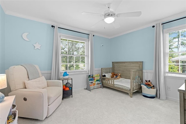 1959 Audubon Dr NE, Atlanta, GA 30329 - carpeted bedroom with a crib, multiple windows, crown molding, and ceiling fan