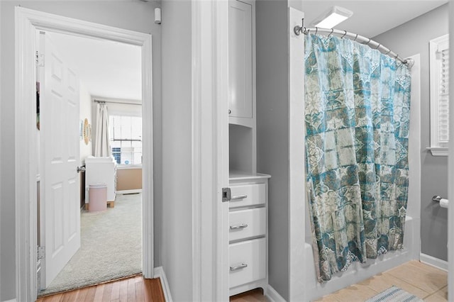 1959 Audubon Dr NE, Atlanta, GA 30329 - full bath featuring shower / bath combo with shower curtain and baseboards