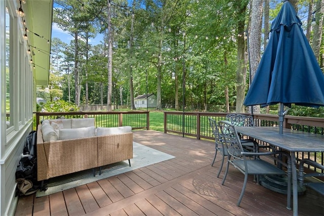 1959 Audubon Dr NE, Atlanta, GA 30329 - wooden terrace with an outdoor hangout area, outdoor dining area, a fenced backyard, and view of scattered trees